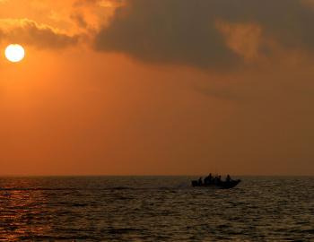 fishing boat in texas gulf at sunset