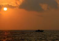 fishing boat in texas gulf at sunset