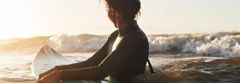A woman surfing in Port Aransas
